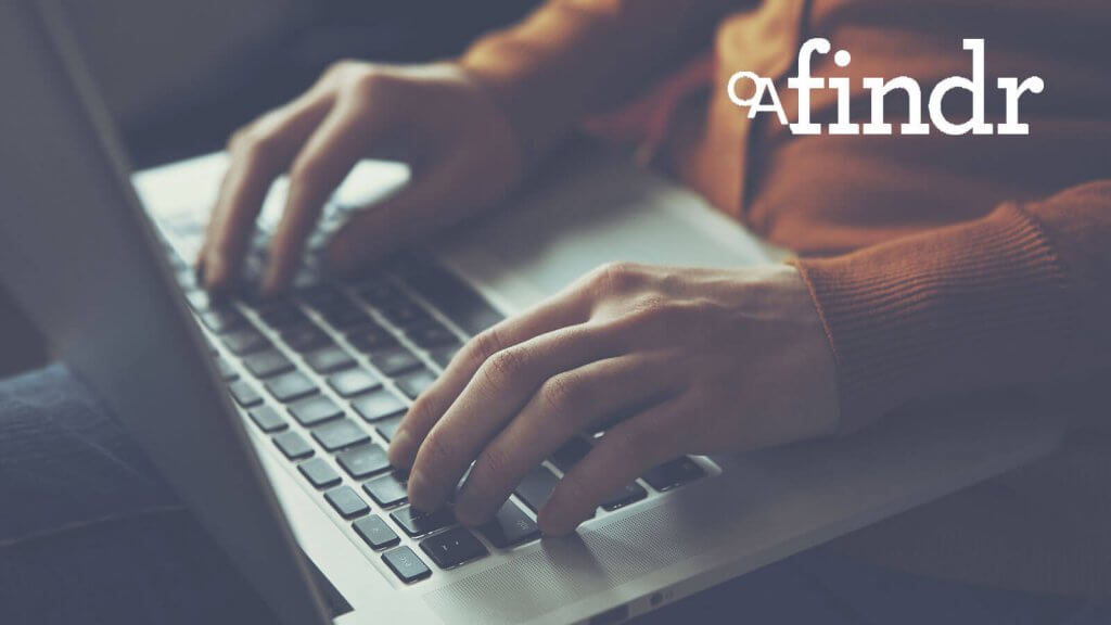 hands typing on laptop keyboard