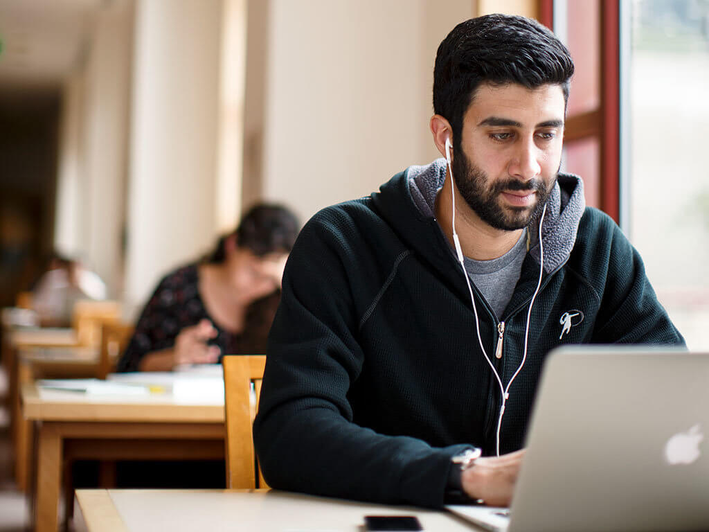 man studying in library