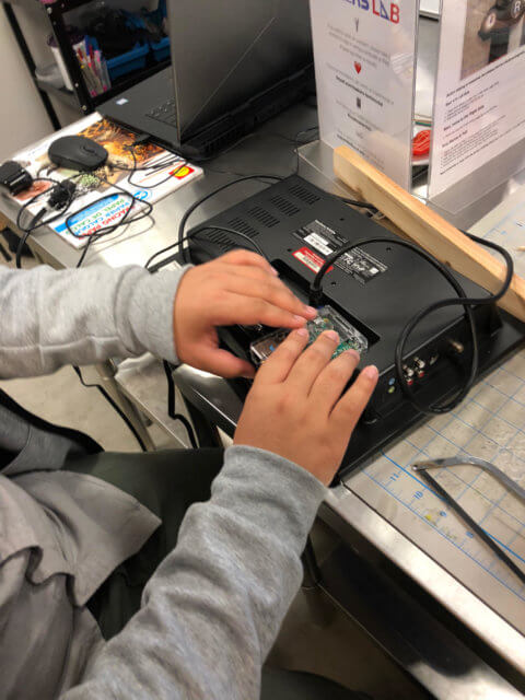 intern setting up smart mirror