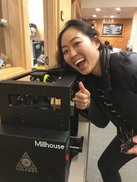 Cecilia next to a 3D printer