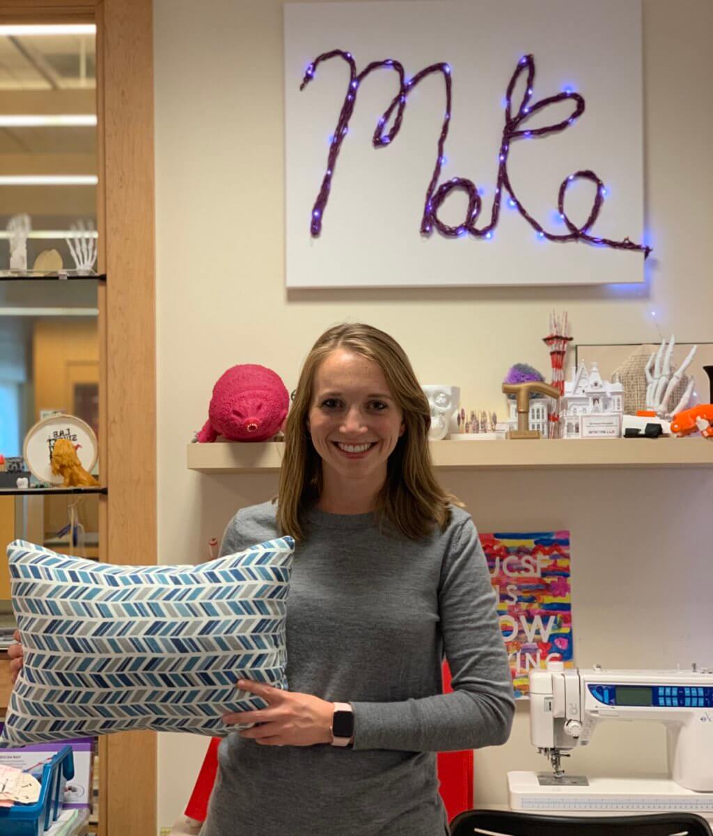 Karsyn with throw pillow in the Makers Lab