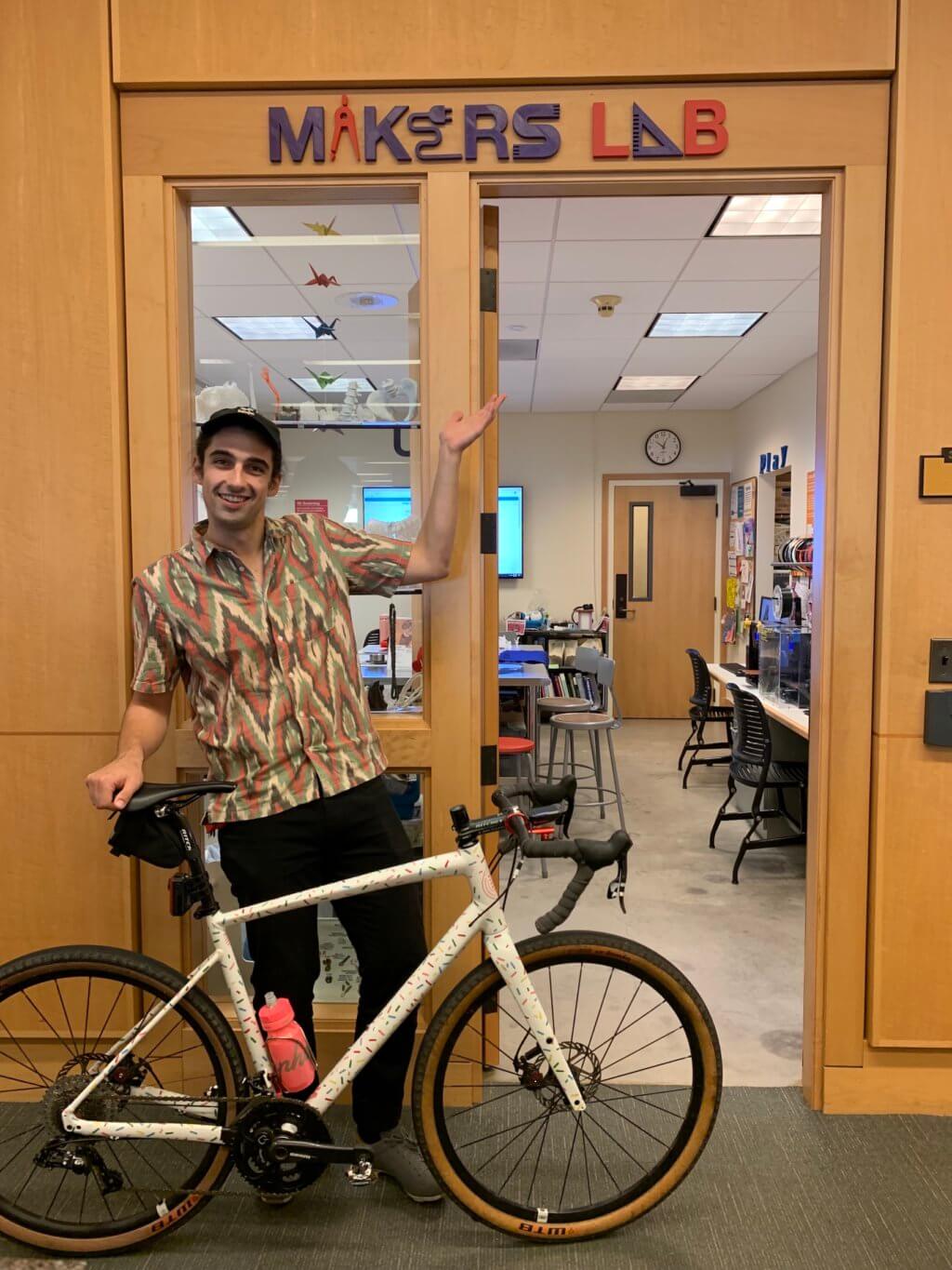 Angelo with bike outside of Makers Lab