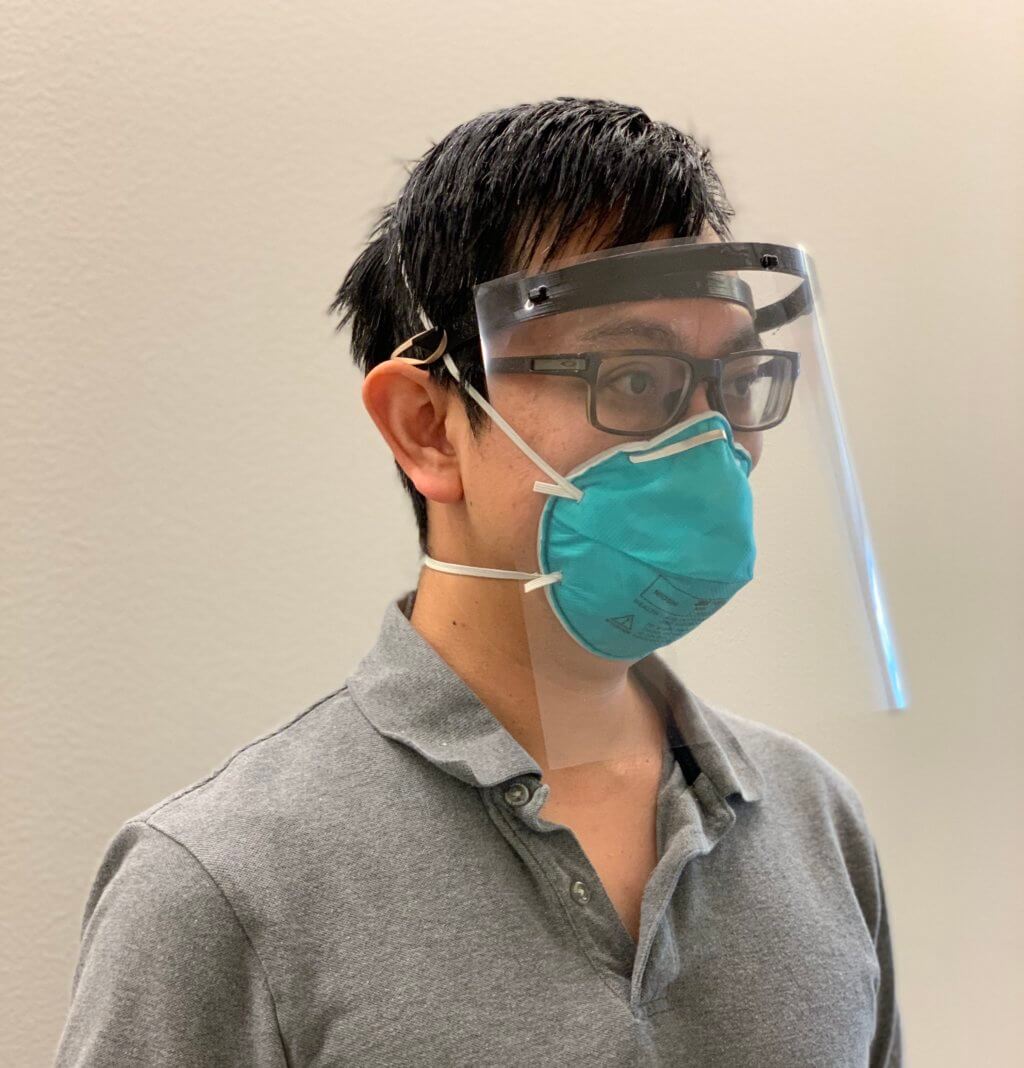 Clinician wearing 3d printed face shield
