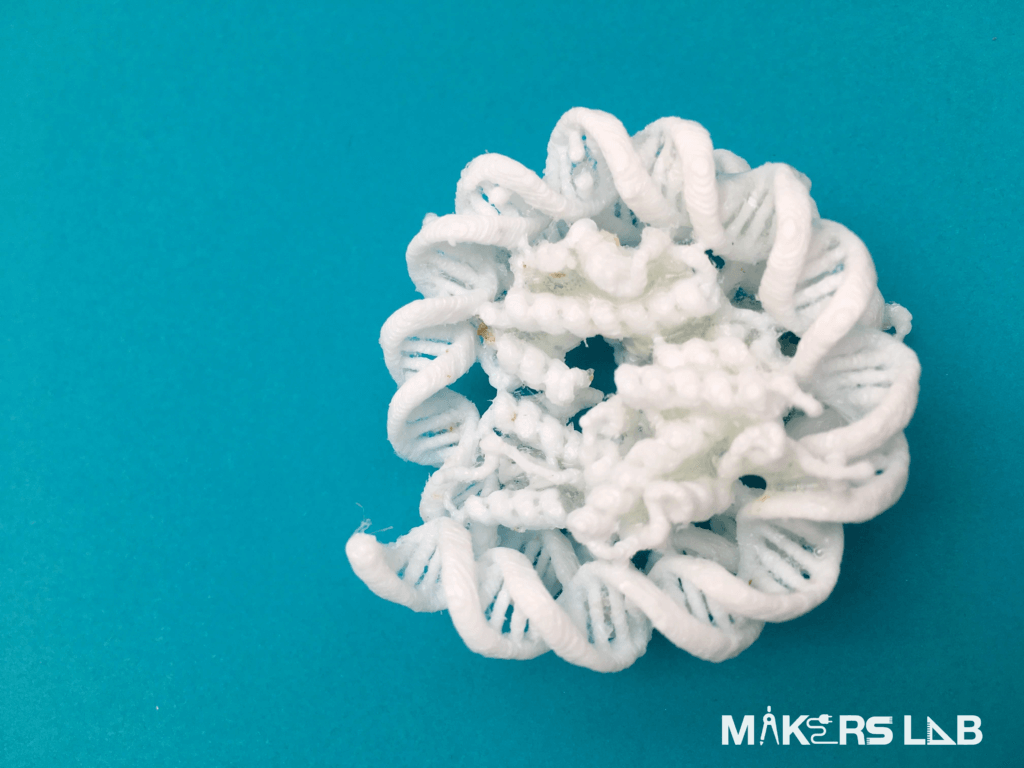 3D printed DNA molecule on blue background