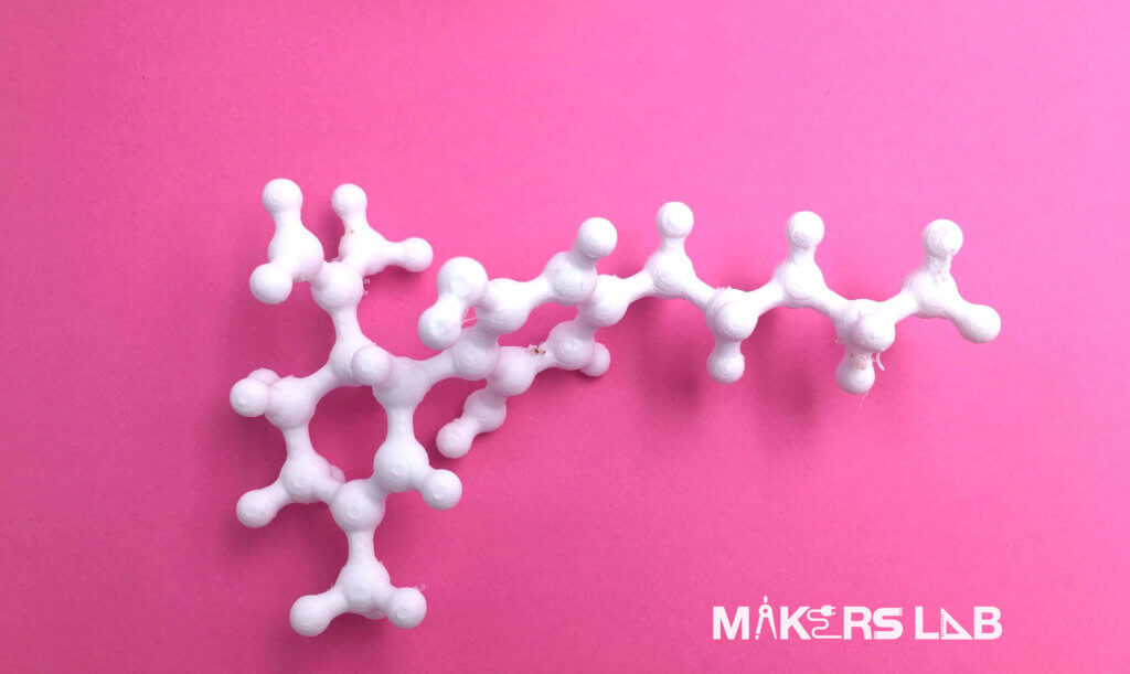 3D printed molecule on a pink background