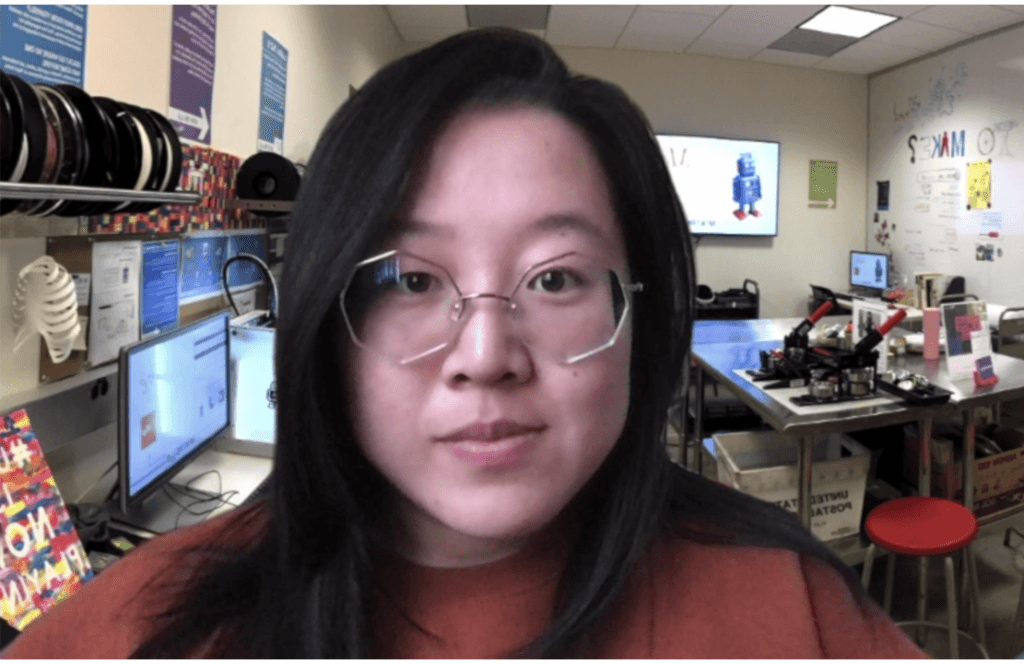 Maker using a Makers Lab background in action during a Zoom meeting