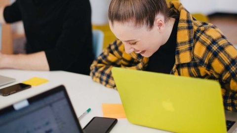 smiling woman with laptop