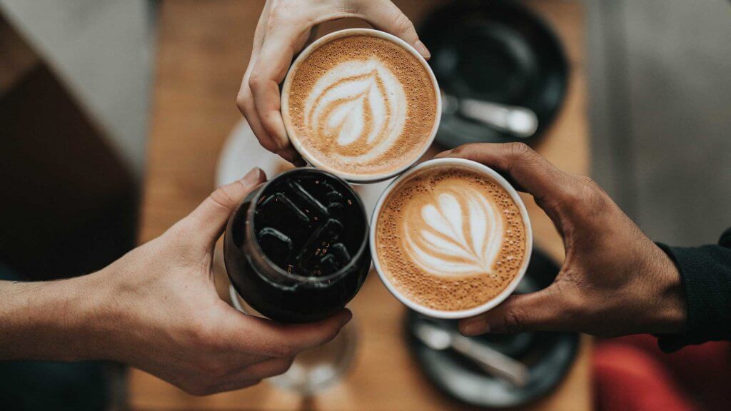 toasting with coffee drinks