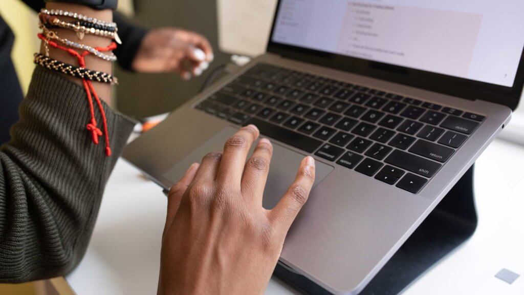 faculty member using laptop