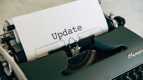 typewriter with paper that says Update