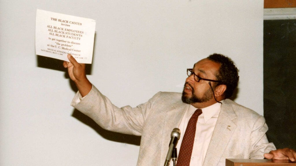 bradley holding black caucus sign
