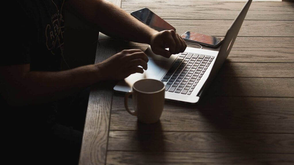 person typing on laptop