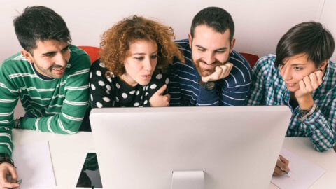 People sharing a computer screen