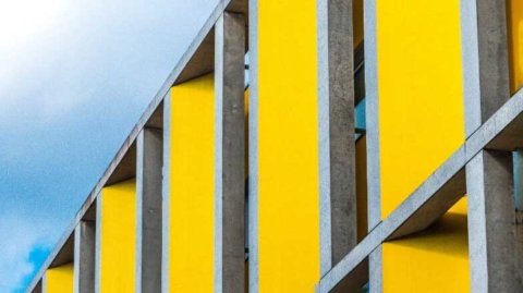 Yellow building facade, ownership policy
