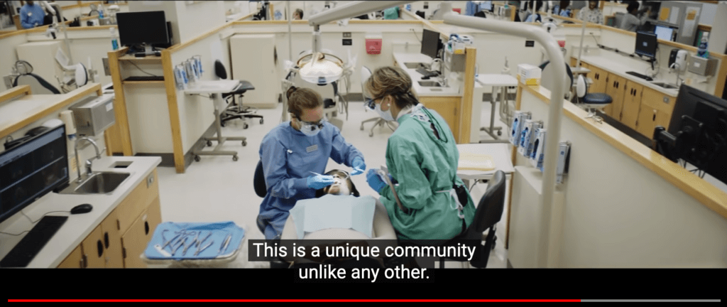 Closed captioning reads "This is a unique community unlike any other" over footage of two people performing a detail exam.