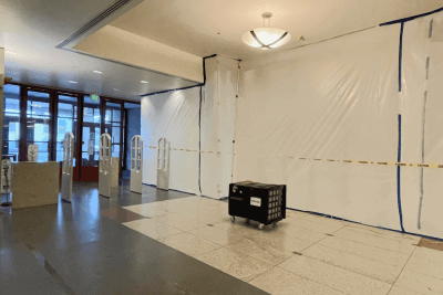 Temporary construction barriers are installed on the third floor of the Kalmanovitz Library.