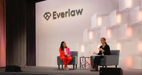 Rachel Taketa and Shana Simmons speaking on stage at the Everlaw Summit