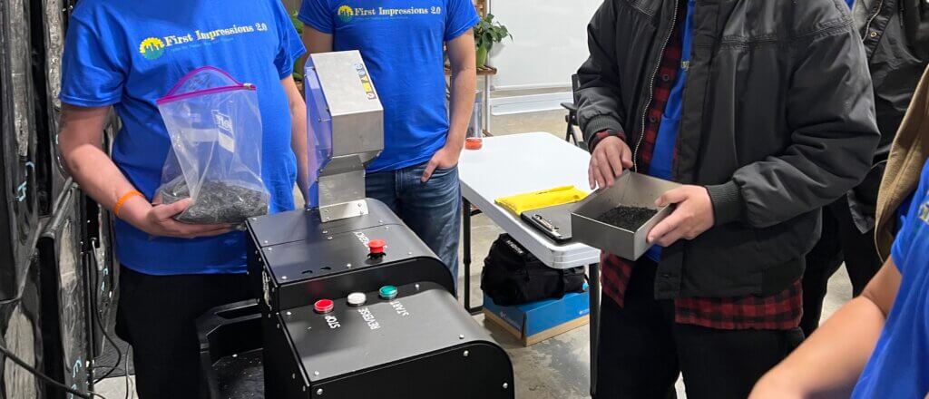 First Impressions trainees shredding 3D printed waste
