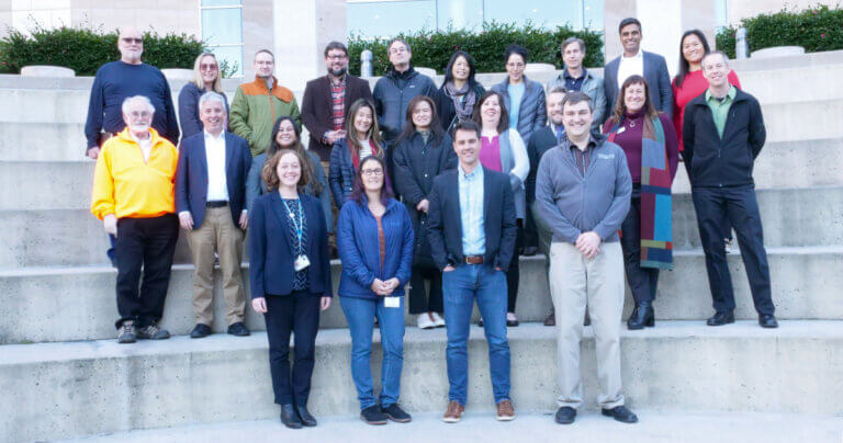 The Opioid Industry Document Archive team standing on steps outside of UCSF's Genentech Hall.