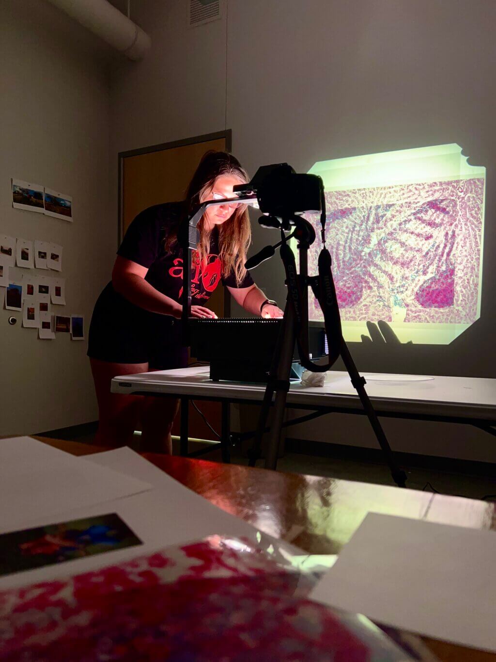 Katina using overhead transparency projector in studio.