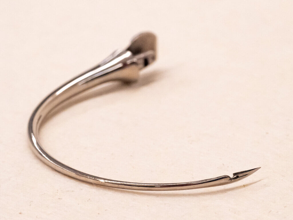 Needle with hole for suture close to the point