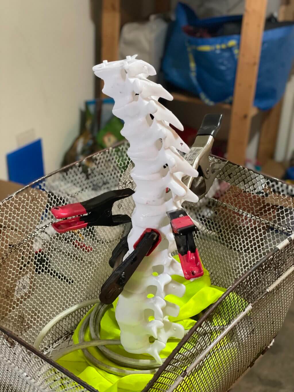 Small clamps holding delicate parts of the 3D-printed spine