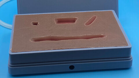 rectangular silicone mold showing four types of wounds.